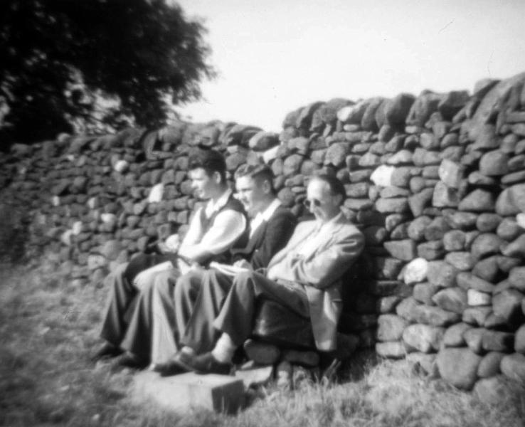 Seated by wall.JPG - Enjoying the sun. On the right is Maurice Stone.   ( Who are the others and when ? )  